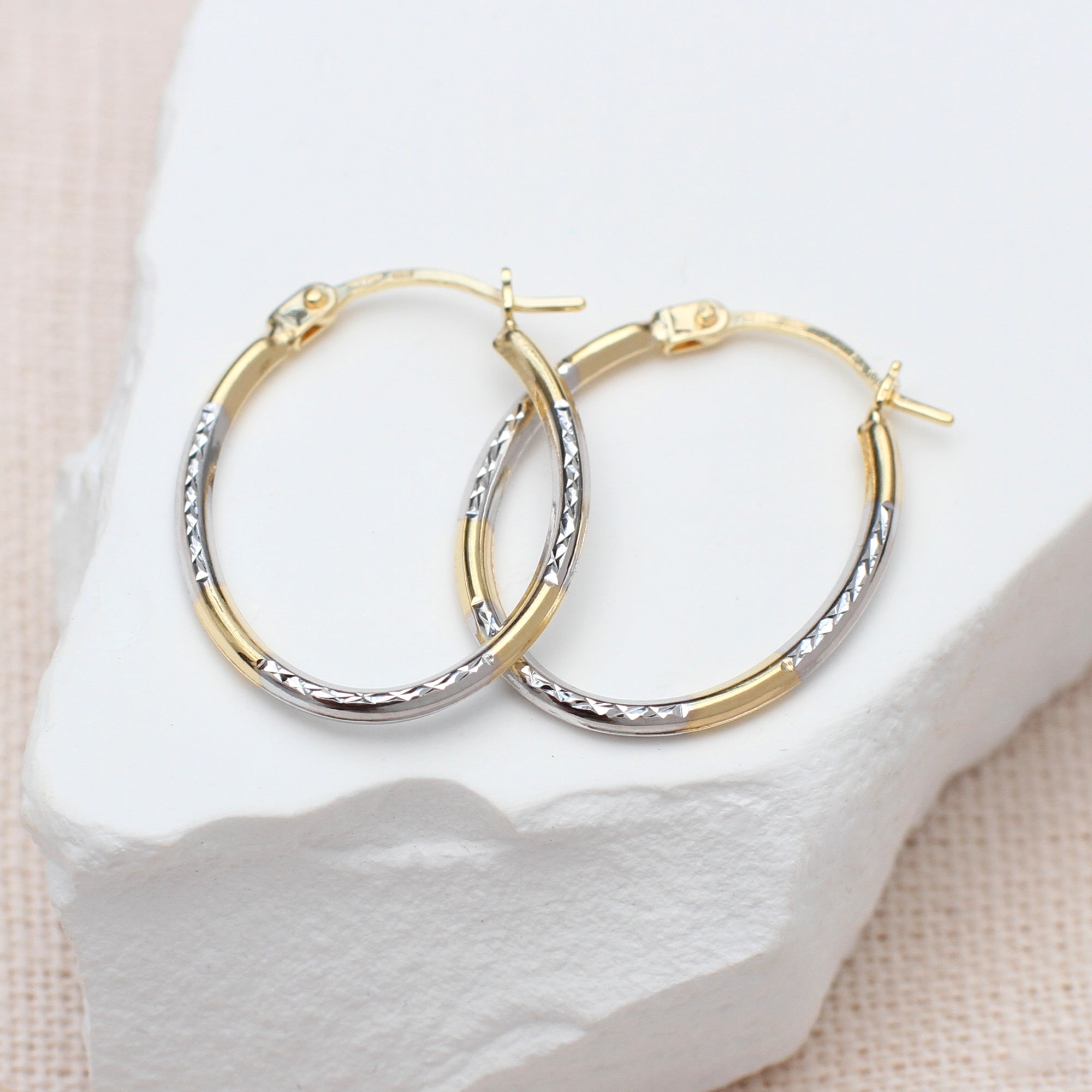 9ct-Two-Tone-Gold-Diamond-Cut-Oval-Creole-Hoops.jpg
