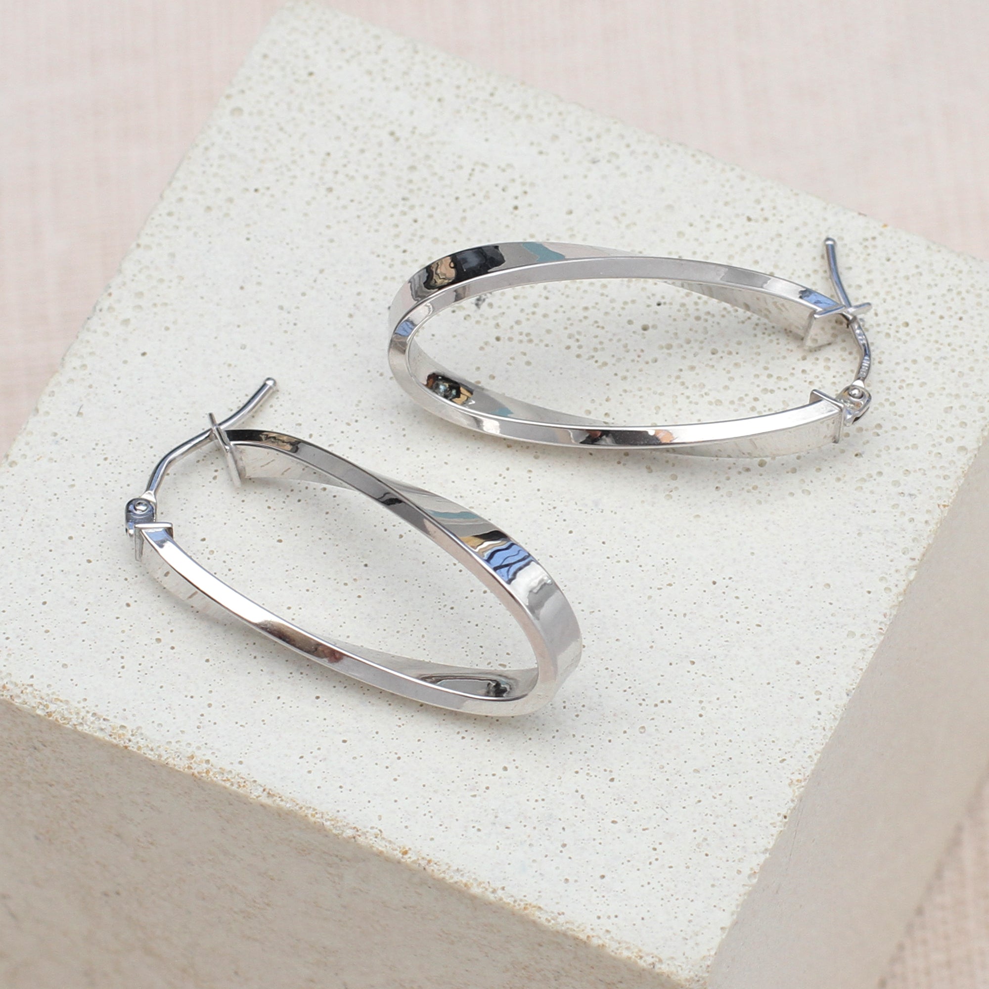 9ct-White-Gold-Twist-Oval-Hoop-Earrings.jpg
